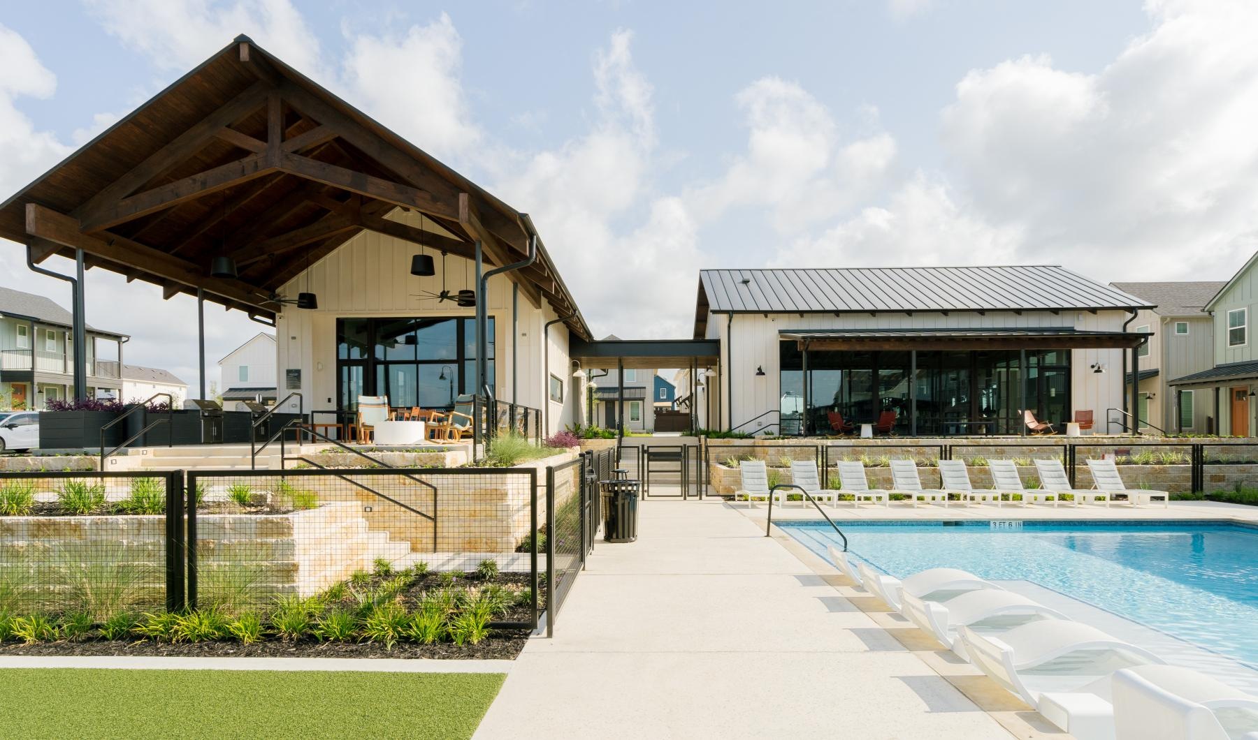 a swimming pool outside of a house