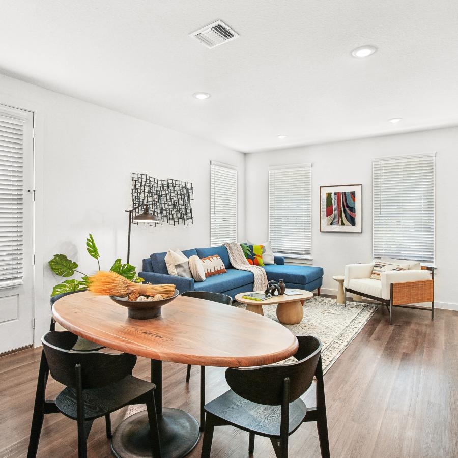 a living room with a table and chairs