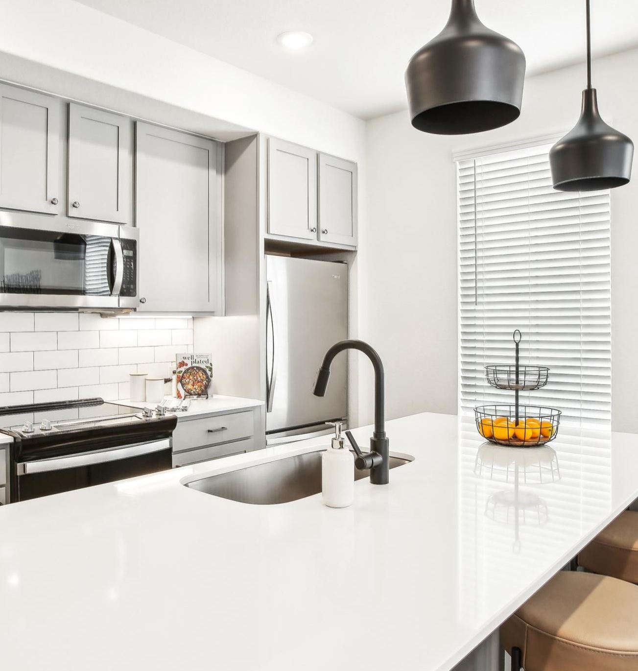 a kitchen with white cabinets